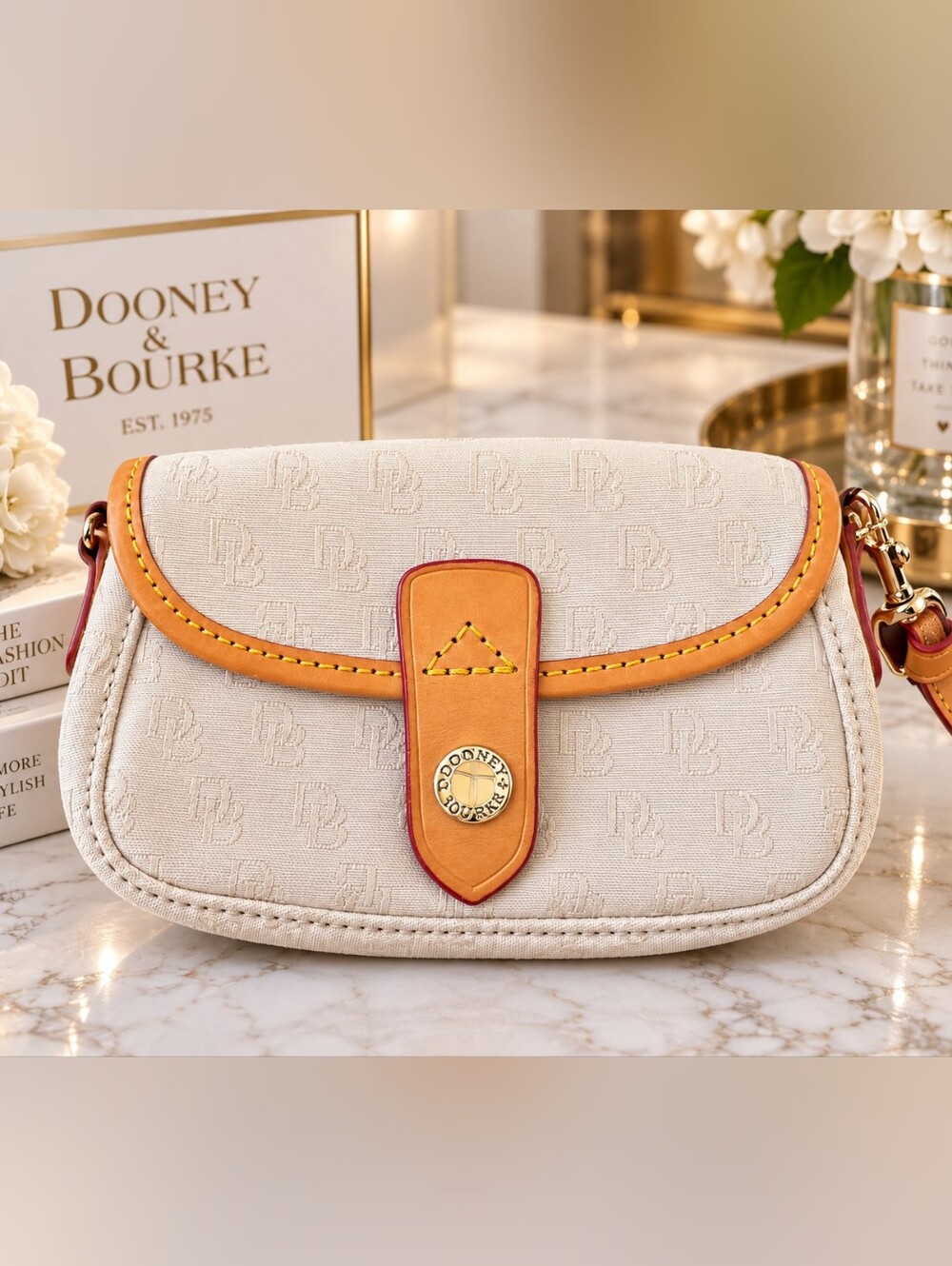 Dooney & Bourke Cream wristlet with Tan Leather Trim